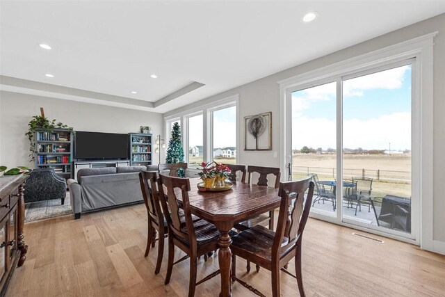 dining area featuring light wood-type flooring