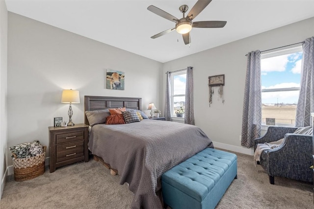 bedroom with light colored carpet and ceiling fan