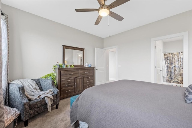 bedroom with light carpet, connected bathroom, and ceiling fan