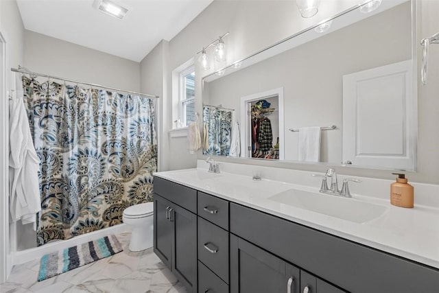 bathroom featuring a shower with curtain, vanity, and toilet