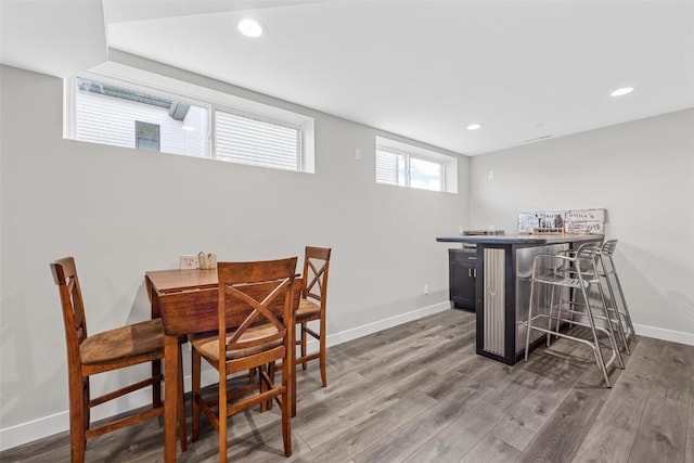 dining area with hardwood / wood-style flooring