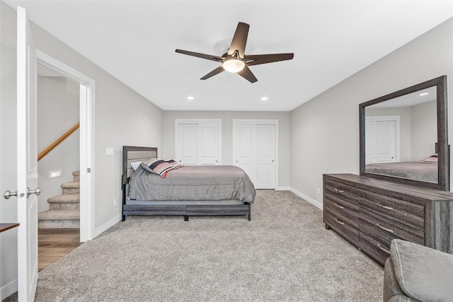 bedroom with light colored carpet and ceiling fan