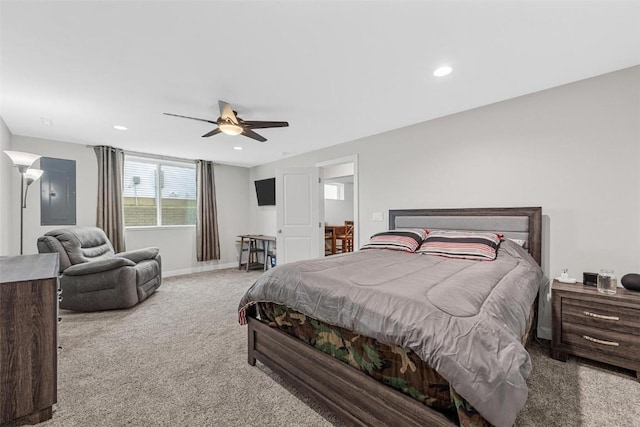 carpeted bedroom with electric panel and ceiling fan