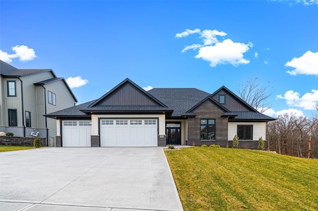 view of front of home featuring a front yard and a garage