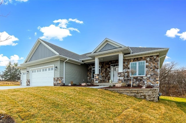 craftsman inspired home featuring a front lawn and a garage