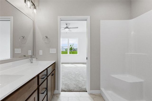 bathroom featuring ceiling fan, tile patterned floors, and vanity