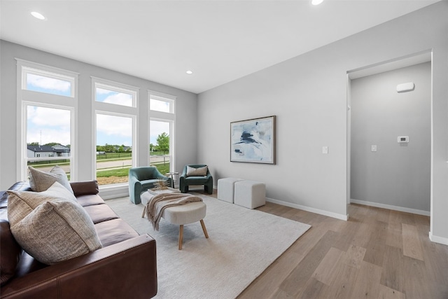 334 Quiver Ct, Marion, IA 52302 - living area with light wood-type flooring, baseboards, and recessed lighting