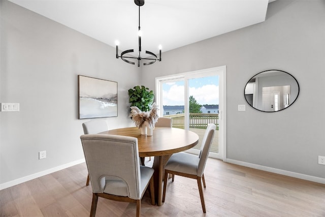 334 Quiver Ct, Marion, IA 52302 - dining room with a chandelier, baseboards, and light wood-style flooring