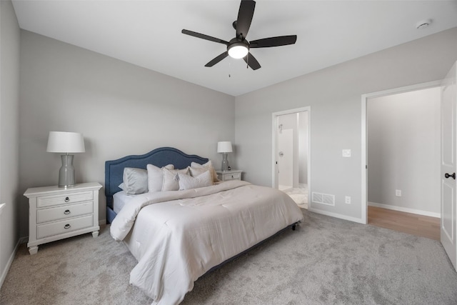 334 Quiver Ct, Marion, IA 52302 - carpeted bedroom featuring baseboards, connected bathroom, and ceiling fan