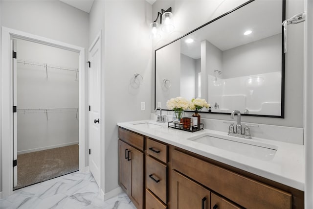 334 Quiver Ct, Marion, IA 52302 - full bath with a shower, marble finish floors, a walk in closet, double vanity, and recessed lighting