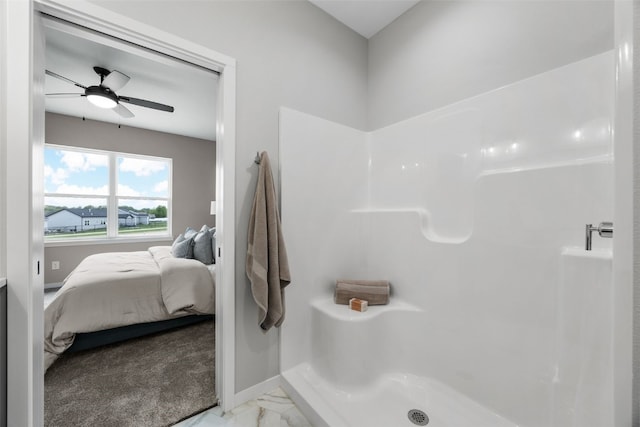 334 Quiver Ct, Marion, IA 52302 - ensuite bathroom with ceiling fan, a stall shower, marble look tiles, and baseboards