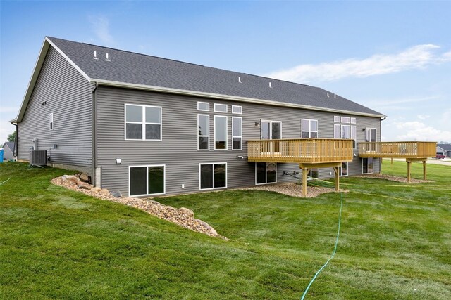 334 Quiver Ct, Marion, IA 52302 - back of property with central AC unit, a yard, a wooden deck, and roof with shingles