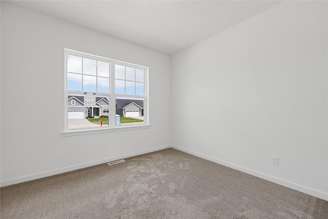 view of carpeted spare room