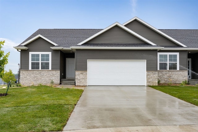 332 Quiver Ct, Marion, IA 52302 - view of front of home featuring stone siding, driveway, an attached garage, and a front lawn