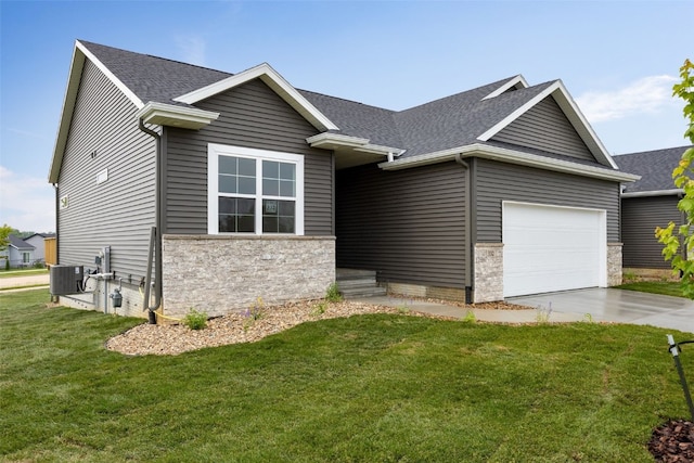 332 Quiver Ct, Marion, IA 52302 - view of front of house with stone siding, an attached garage, a front yard, and a shingled roof
