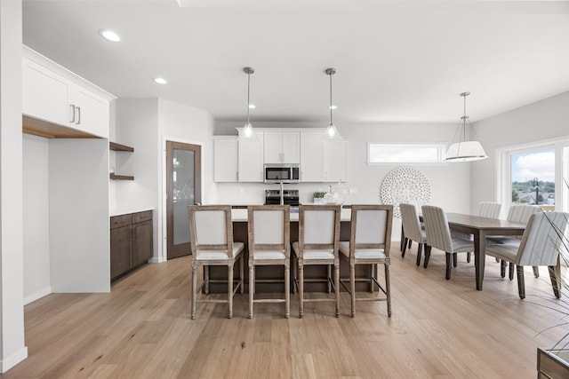 332 Quiver Ct, Marion, IA 52302 - dining room featuring light wood-type flooring and recessed lighting