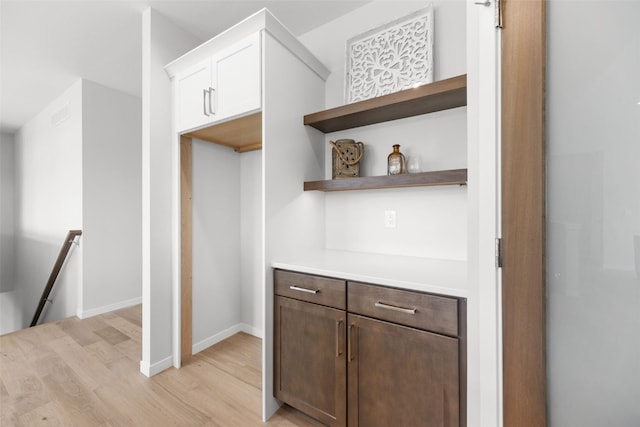 332 Quiver Ct, Marion, IA 52302 - bar featuring light wood-type flooring and baseboards