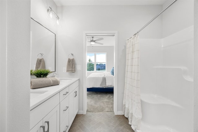 332 Quiver Ct, Marion, IA 52302 - ensuite bathroom with double vanity, ceiling fan, and shower / bath combination with curtain