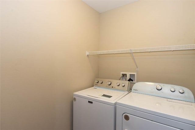 laundry area with independent washer and dryer