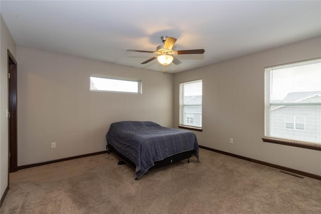 carpeted bedroom with ceiling fan