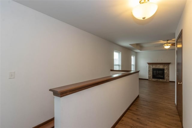 corridor with dark hardwood / wood-style flooring