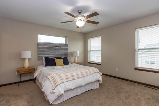 1135 Redbud Ave, Tiffin, IA 52340 - carpeted bedroom featuring baseboards and ceiling fan
