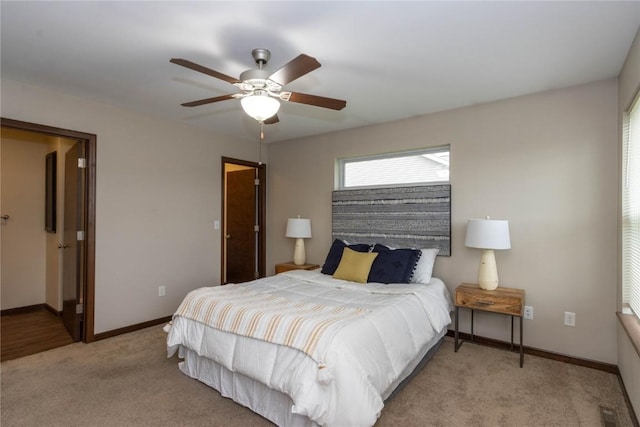 1135 Redbud Ave, Tiffin, IA 52340 - bedroom featuring carpet floors, baseboards, and a ceiling fan