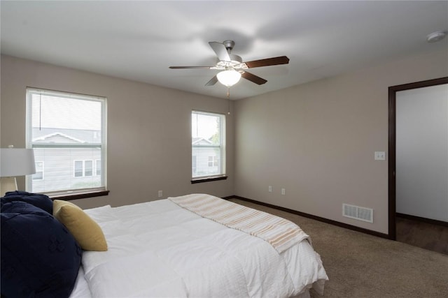 1135 Redbud Ave, Tiffin, IA 52340 - carpeted bedroom featuring baseboards and ceiling fan