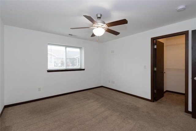 1135 Redbud Ave, Tiffin, IA 52340 - carpeted empty room with a smoke detector, a ceiling fan, and baseboards