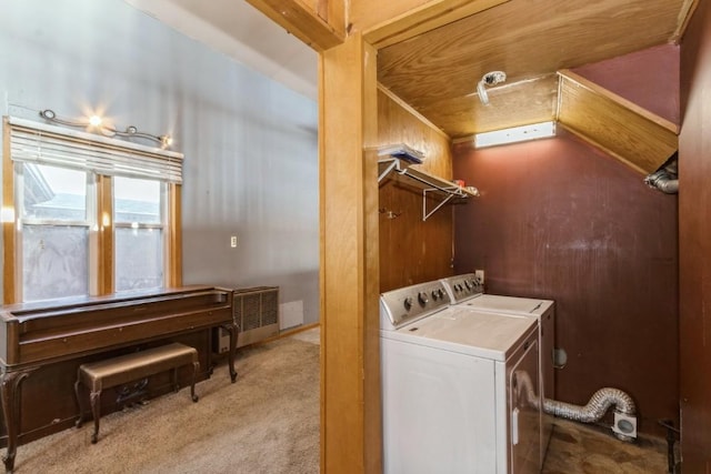 laundry area with washer and dryer and light colored carpet