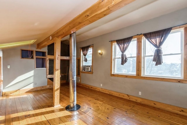 bonus room with hardwood / wood-style floors and cooling unit