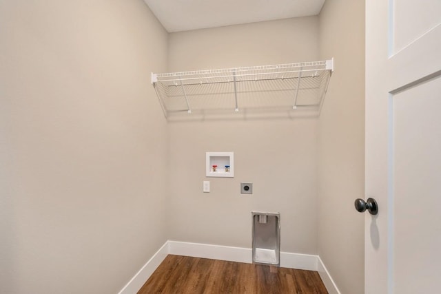 laundry room featuring hookup for an electric dryer, laundry area, dark wood-style flooring, washer hookup, and baseboards