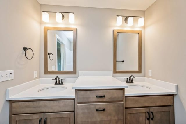 bathroom with double vanity and a sink