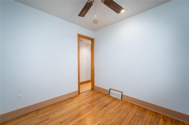 spare room featuring ceiling fan and light hardwood / wood-style floors