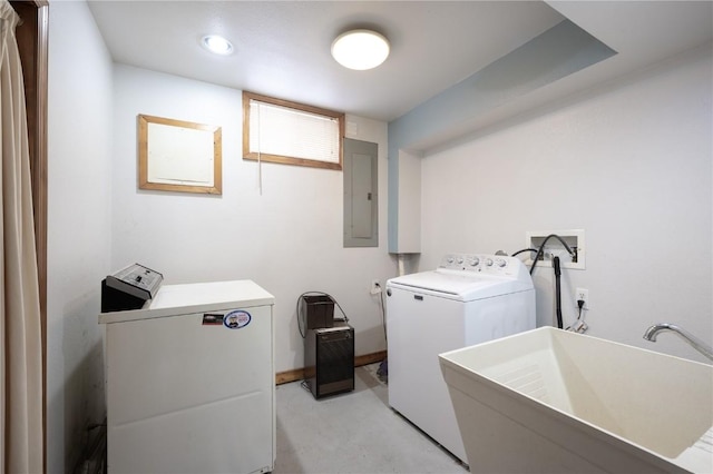 clothes washing area with sink, electric panel, and washing machine and clothes dryer