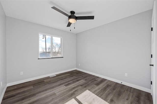 unfurnished room with dark hardwood / wood-style floors and ceiling fan