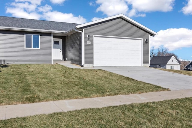 single story home with a garage and a front lawn