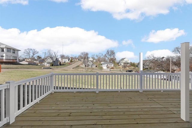 wooden deck featuring a yard