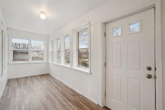 unfurnished sunroom featuring plenty of natural light