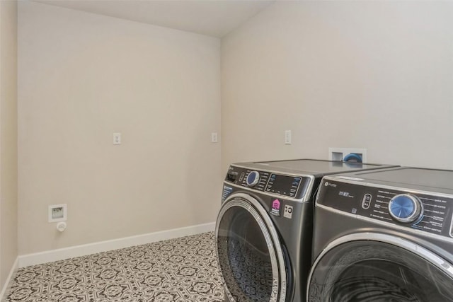 clothes washing area featuring separate washer and dryer