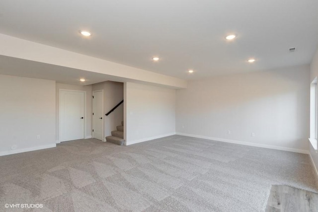 unfurnished room with light carpet