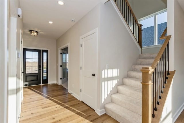 entryway with light hardwood / wood-style flooring