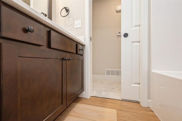 1913 Holly Meadow Ave SW, Cedar Rapids, IA 52404 - bathroom with wood finished floors and baseboards