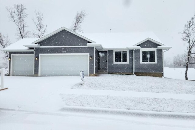 single story home with a garage