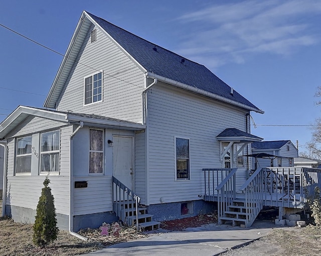 view of side of property featuring a deck