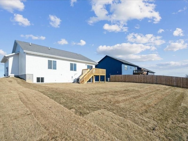 rear view of property with a yard