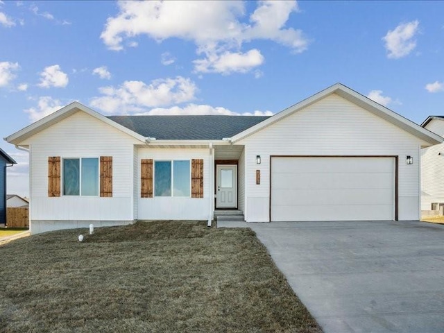 single story home with a front yard and a garage