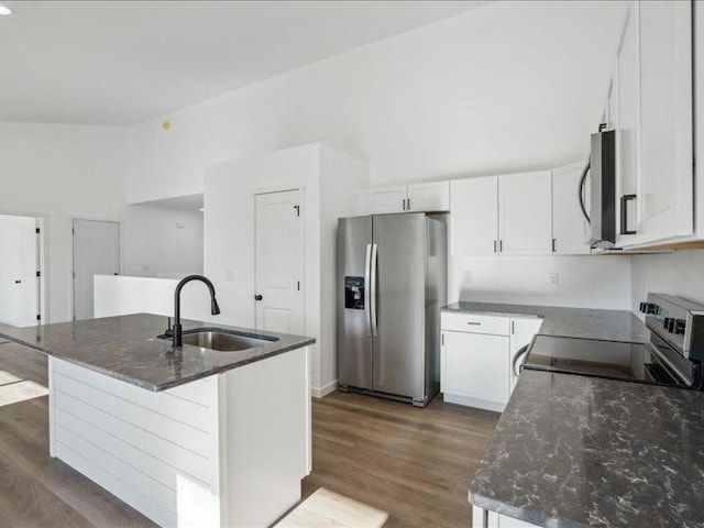 kitchen with a kitchen island with sink, sink, white cabinets, and stainless steel appliances