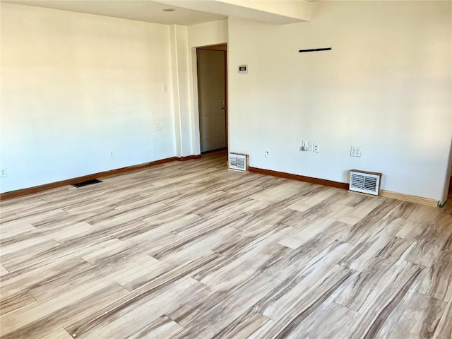 unfurnished room featuring light hardwood / wood-style flooring