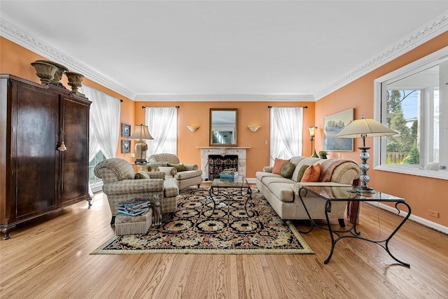 living room featuring light hardwood / wood-style flooring and ornamental molding